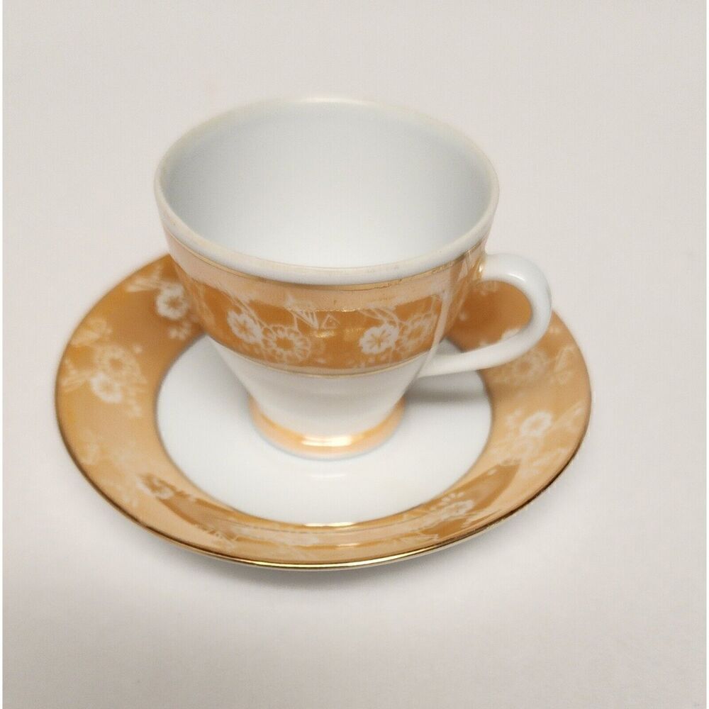 FOOTED MINITURE TEACUP AND SAUCER SET YELLOW W/ GOLD TRIM